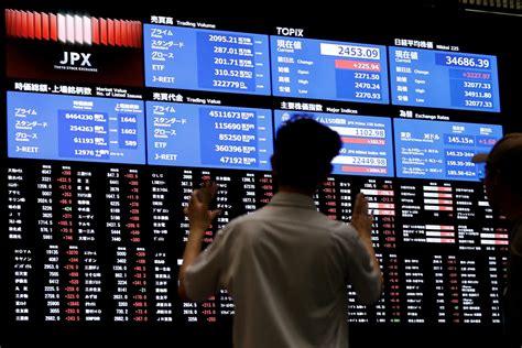 Asia Shares Set for Solid Monthly Gain, Dollar Slumps on .